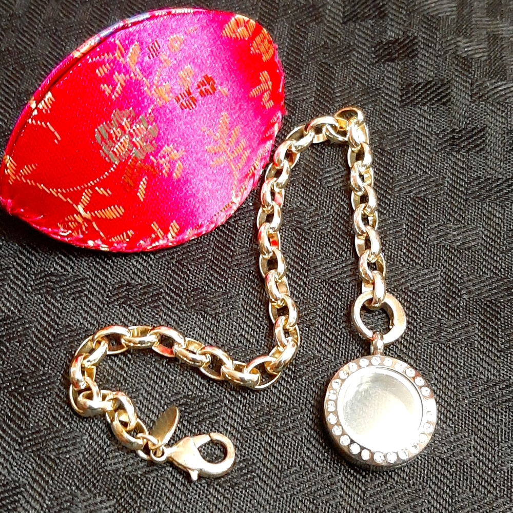 Origami Owl silver bracelet with charms.